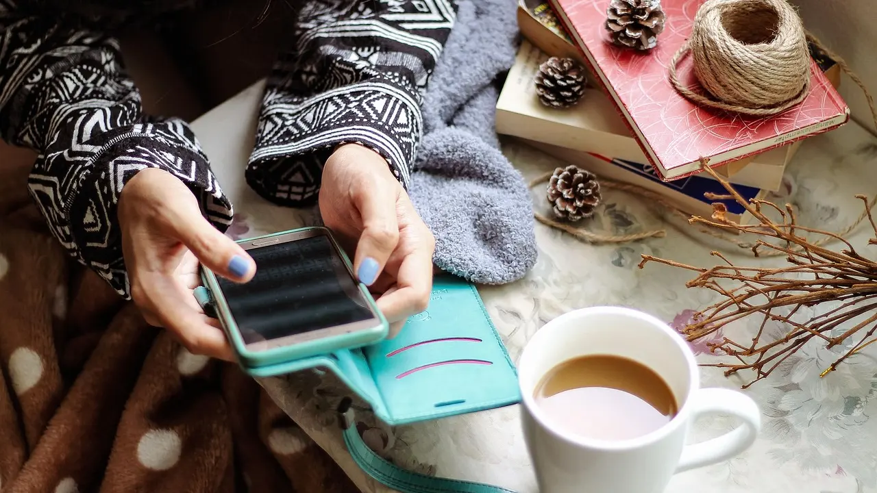 A person reading social media news on a phone